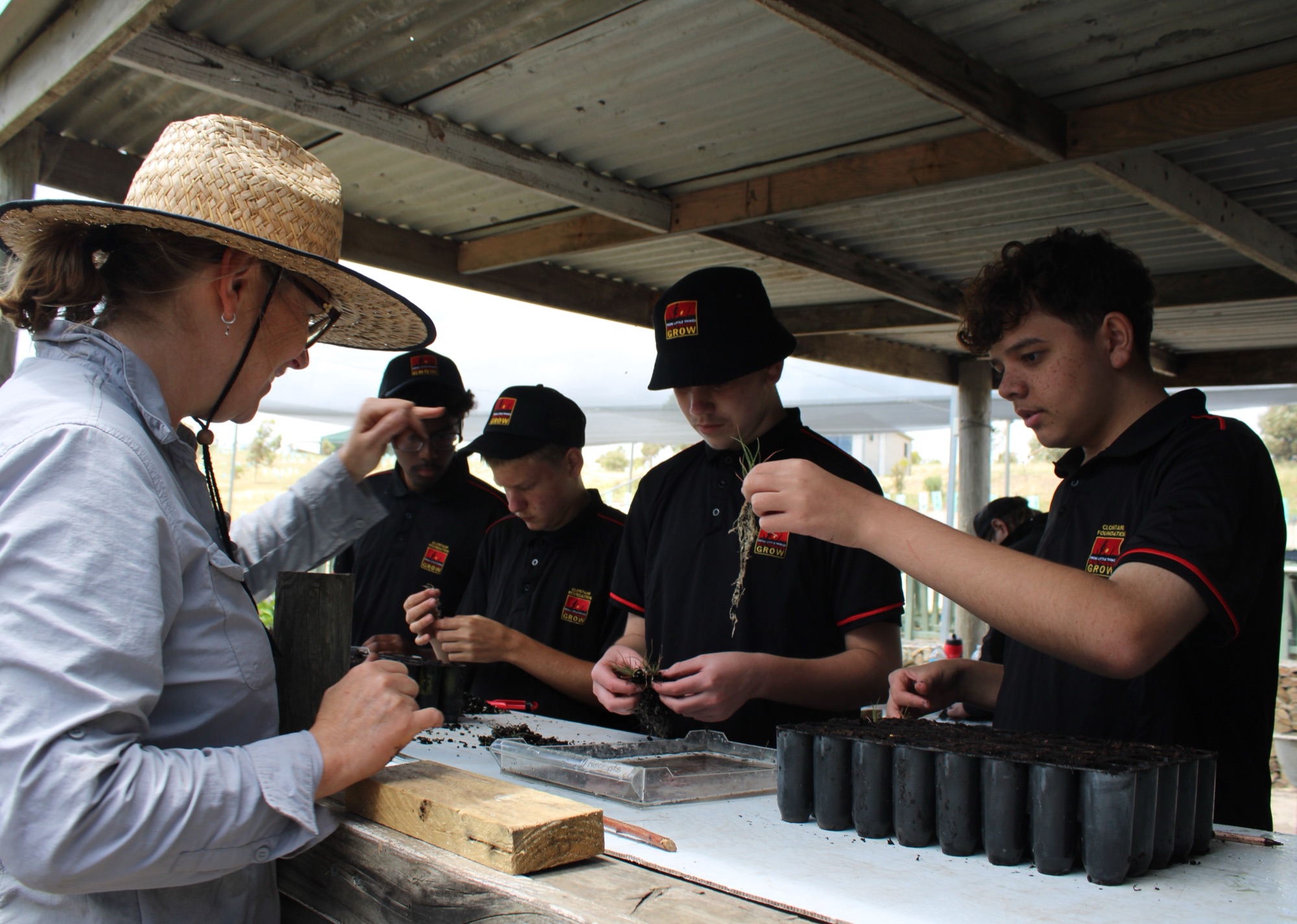 Students potting native seedlings in The Forktree Project nursery